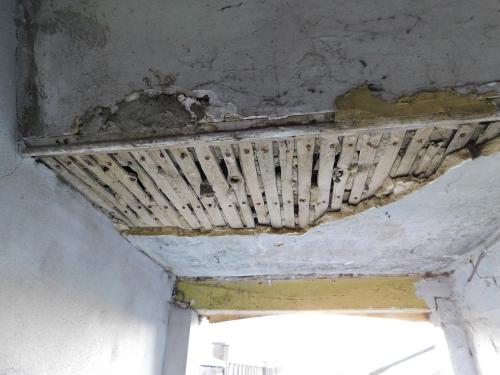 Partially collapsed lath and plaster ceiling at property in Newport