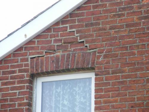 Failed timber lintel on inner leaf of wall causing arch to fail at flat in Shanklin